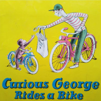 CURIOUS GEORGE RIDES A BIKE